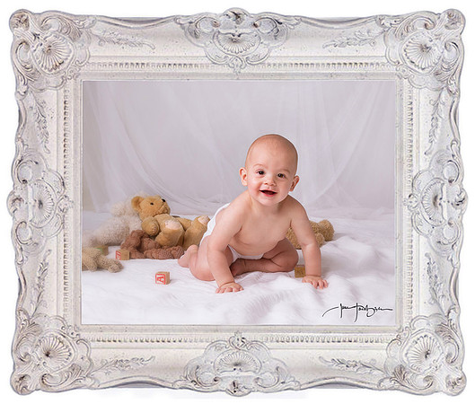 smiling baby portrait in white frame