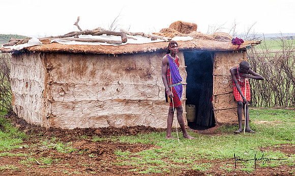 Masai hut with tribe members